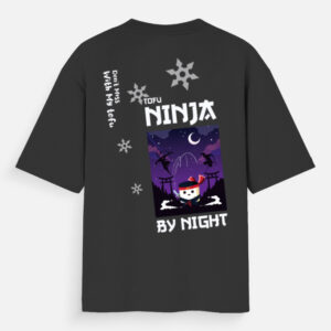 Black oversized unisex T-shirt featuring “Tofu Ninja by Night” design with cute tofu ninja character, night sky, and ninja silhouettes with a warning on the back.