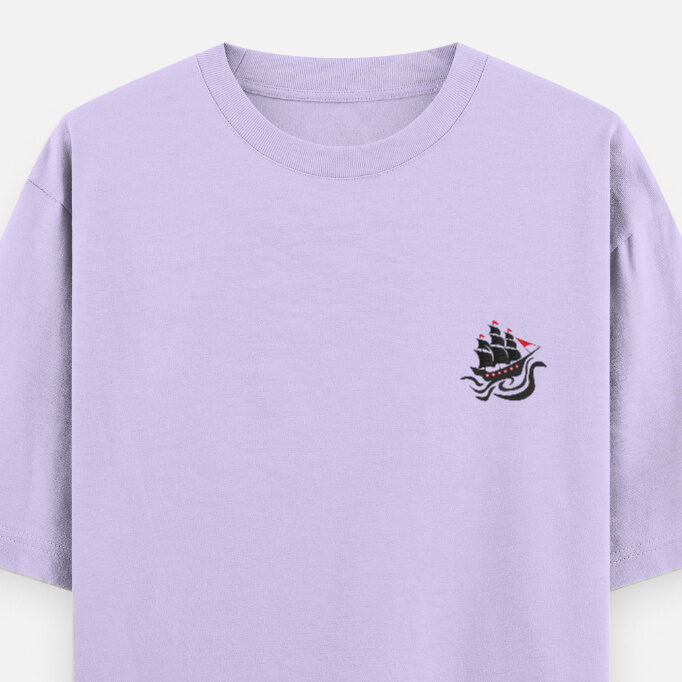 Lavender oversized unisex T-shirt featuring the “Captain of Chaos” pirate ship design on the front.