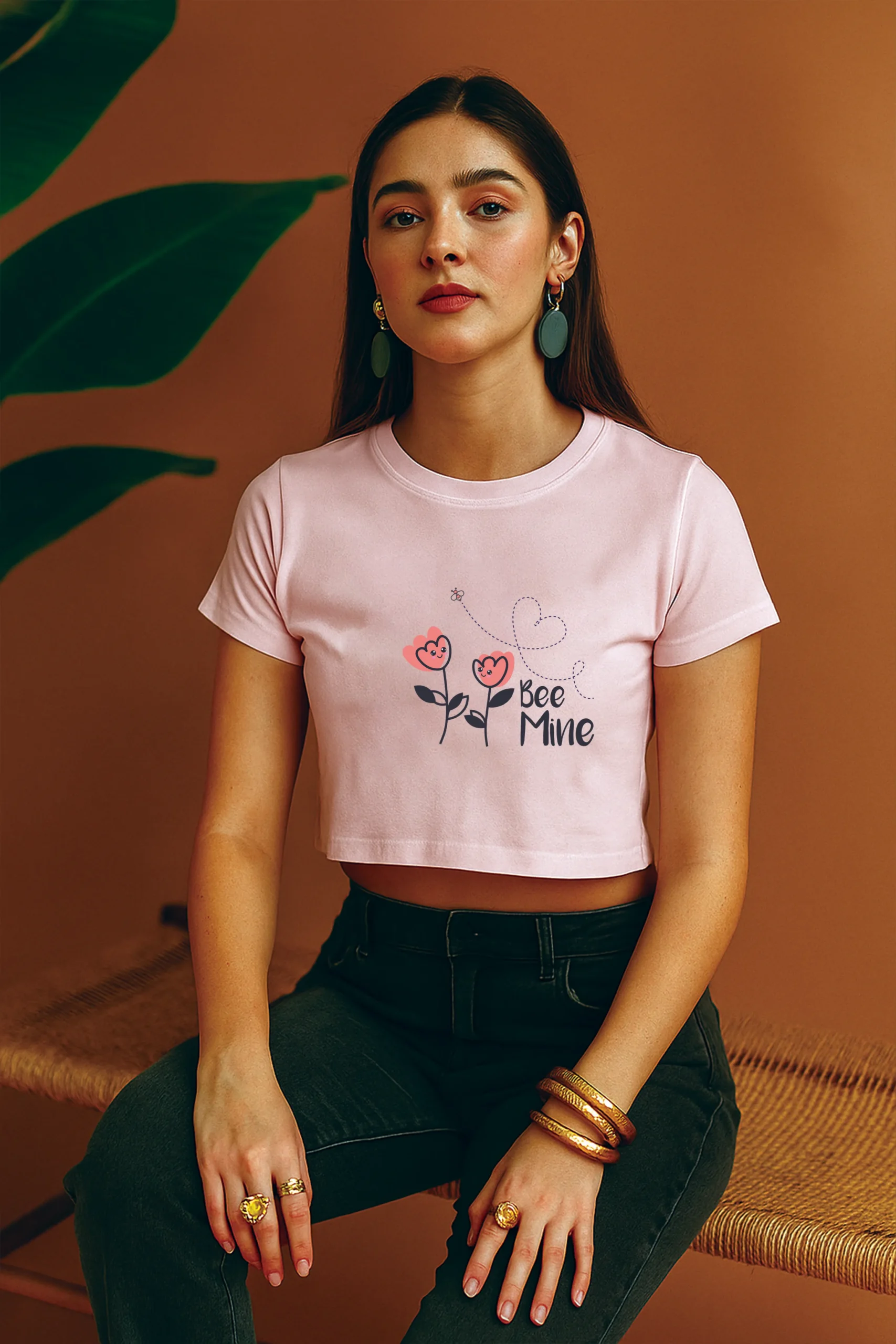 Girl wearing a light baby pink Bee mine crop top